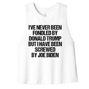 I'VE NEVER BEEN FONDLED BY DONALD TRUMP BUT I HAVE BEEN SCREWED BY JOE BIDEN Women's Racerback Cropped Tank