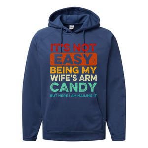 It's Not Easy Being My Wife's Arm Candy But Here I Am Nailin Performance Fleece Hoodie