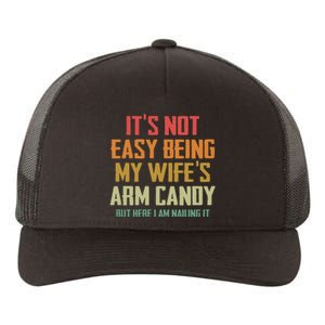 Its Not Easy Being My Wifes Arm Candy Yupoong Adult 5-Panel Trucker Hat