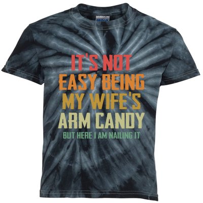 Its Not Easy Being My Wifes Arm Candy Kids Tie-Dye T-Shirt