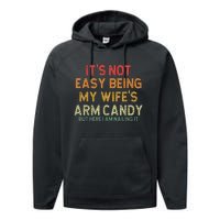 It's Not Easy Being My Wife's Arm Candy But Here I Am Nailin Performance Fleece Hoodie