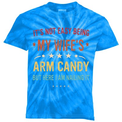 Its Not Easy Being My Wifes Arm Candy Here I Am Nailing It Kids Tie-Dye T-Shirt