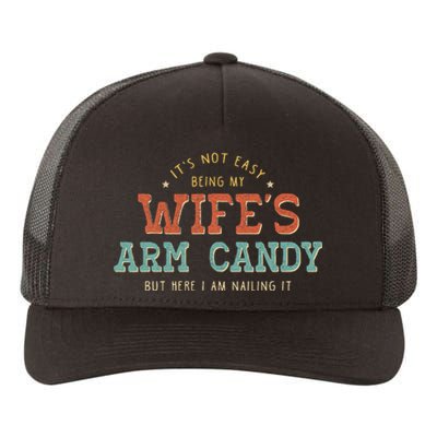 Its Not Easy Being My Wifes Arm Candy Here I Am Yupoong Adult 5-Panel Trucker Hat