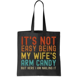 It's Not Easy Being My Wife's Arm Candy but here I am nailin Tote Bag