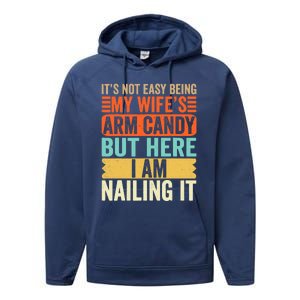 It's Not Easy Being My Wife's Arm Candy But Here I Am Nailin Performance Fleece Hoodie