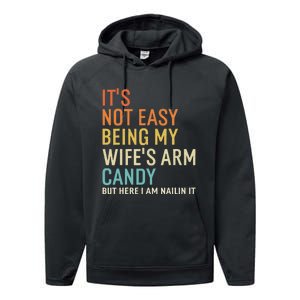 It's Not Easy Being My Wife's Arm Candy But Here I Am Nailin Performance Fleece Hoodie