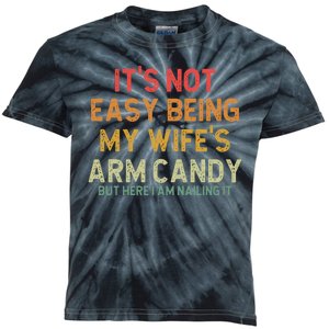 Its Not Easy Being My Wifes Arm Candy Fathers Day Kids Tie-Dye T-Shirt