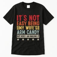 Its Not Easy Being My Wifes Arm Candy Here I Am Nailing It Tall T-Shirt