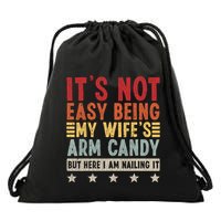 Its Not Easy Being My Wifes Arm Candy Here I Am Nailing It Drawstring Bag