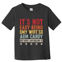 Its Not Easy Being My Wifes Arm Candy Here I Am Nailing It Toddler T-Shirt