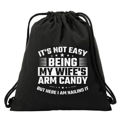 Its Not Easy Being My Wifes Arm Candy Here I Am Nailing It Drawstring Bag
