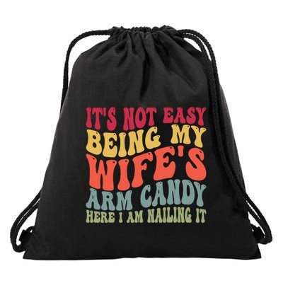 Its Not Easy Being My Wifes Arm Candy Here I Am Nailing It Drawstring Bag