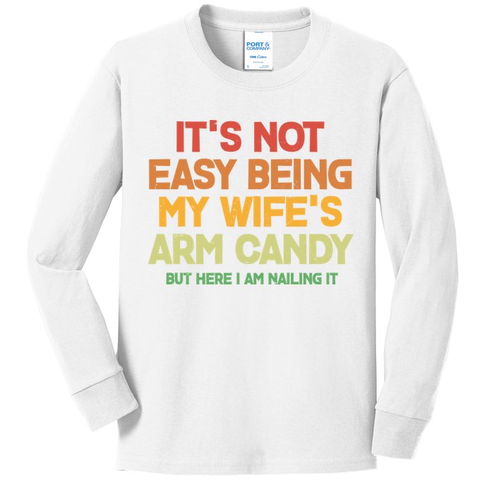 Its Not Easy Being My Wifes Arm Candy But Here I Am Nailing It Kids Long Sleeve Shirt