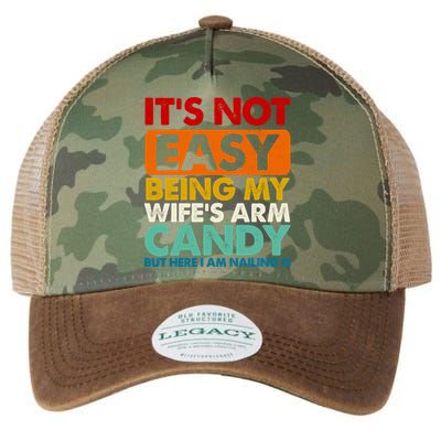 Its Not Easy Being My Wifes Arm Candy But Here I Am Funny Gift Legacy Tie Dye Trucker Hat