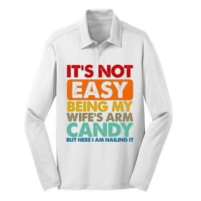 Its Not Easy Being My Wifes Arm Candy But Here I Am Funny Gift Silk Touch Performance Long Sleeve Polo