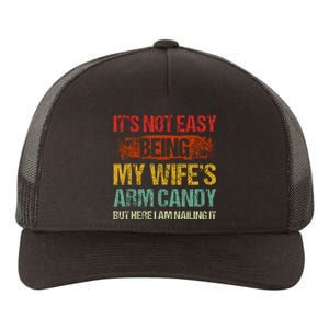 Its Not Easy Being My Wifes Arm Candy But Here I Am Nailin Yupoong Adult 5-Panel Trucker Hat