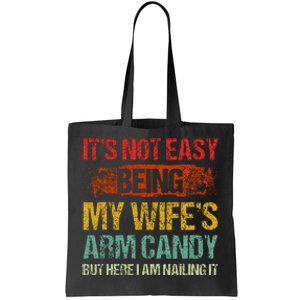 Its Not Easy Being My Wifes Arm Candy But Here I Am Nailin Tote Bag