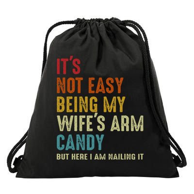 Its Not Easy Being My Wifes Arm Candy But Here I Am Nailin Drawstring Bag