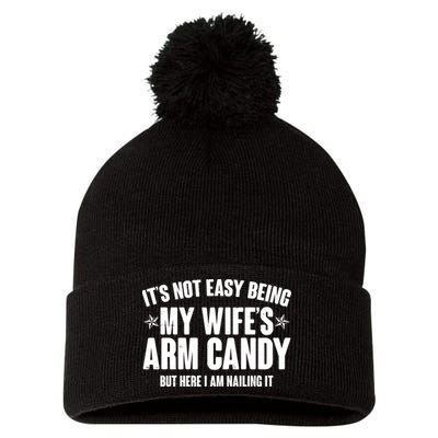 It's Not Easy Being My Wife's Arm Candy But Here I Am Nailing It Pom Pom 12in Knit Beanie