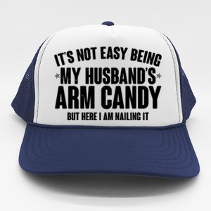 It's Not Easy Being My Husband's Arm Candy But Here I Am Nailing It Trucker Hat