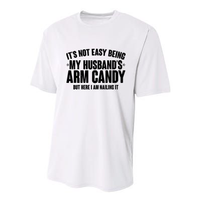 It's Not Easy Being My Husband's Arm Candy But Here I Am Nailing It Youth Performance Sprint T-Shirt