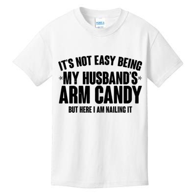 It's Not Easy Being My Husband's Arm Candy But Here I Am Nailing It Kids T-Shirt