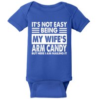 Its Not Easy Being My Wifes Arm Candy But Here I Am Nailing It Funny Baby Bodysuit