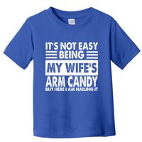 Its Not Easy Being My Wifes Arm Candy But Here I Am Nailing It Funny Toddler T-Shirt