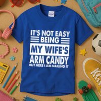 Its Not Easy Being My Wifes Arm Candy But Here I Am Nailing It Funny Kids T-Shirt