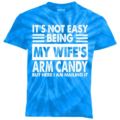 Its Not Easy Being My Wifes Arm Candy But Here I Am Nailing It Funny Kids Tie-Dye T-Shirt