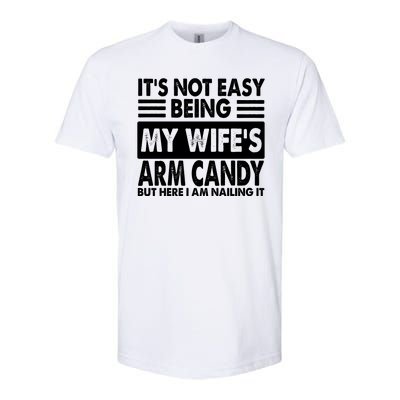 Its Not Easy Being My Wifes Arm Candy But Here I Am Nailing It Funny Softstyle® CVC T-Shirt