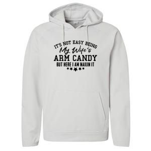 Its Not Easy Being My Wifes Arm Candy But Here I Am Nailin It Performance Fleece Hoodie