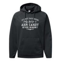 Its Not Easy Being My Wifes Arm Candy But Here I Am Nailin It Performance Fleece Hoodie