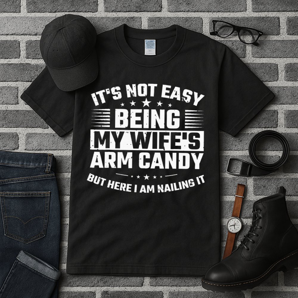 Its Not Easy Being My Wifes Arm Candy Here I Am Nailing It Tall T-Shirt