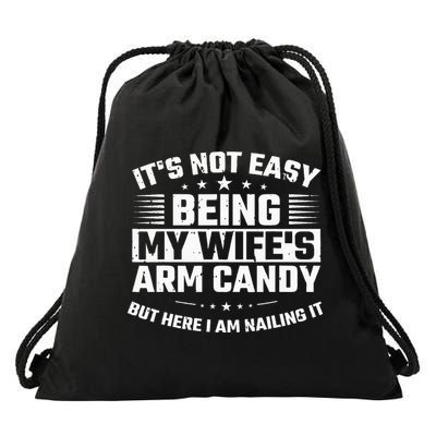 Its Not Easy Being My Wifes Arm Candy Here I Am Nailing It Drawstring Bag