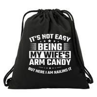 Its Not Easy Being My Wifes Arm Candy Here I Am Nailing It Drawstring Bag