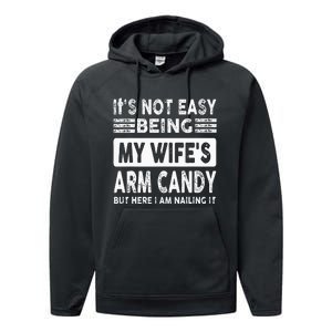 Its Not Easy Being My Wifes Arm Candy But Here I Am Nailin  Performance Fleece Hoodie