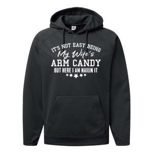 Its Not Easy Being My Wifes Arm Candy But Here I Am Nailin It Performance Fleece Hoodie