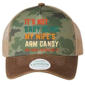 It's Not Easy Being My Wife's Arm Candy Legacy Tie Dye Trucker Hat