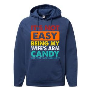 It's Not Easy Being My Wife's Arm Candy But Here I Am Funny Performance Fleece Hoodie