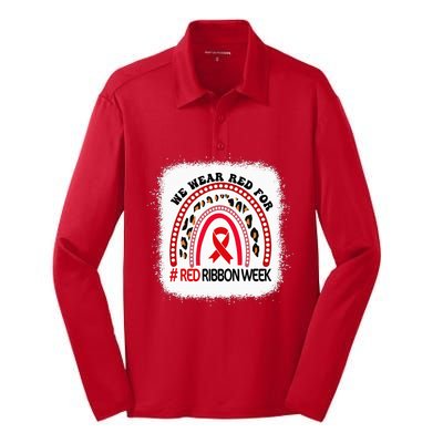 In October We Wear Red Ribbon Week Awareness Silk Touch Performance Long Sleeve Polo