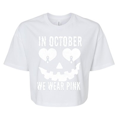 In October We Wear Pink Breast Cancer Jackolantern Halloween Bella+Canvas Jersey Crop Tee