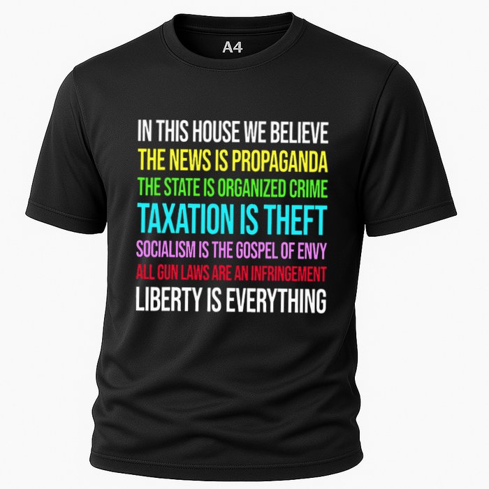 In This House We Believe The News Is Propaganda Cooling Performance Crew T-Shirt