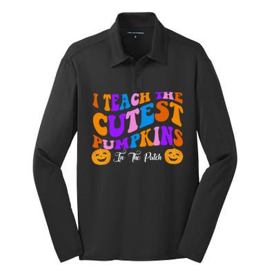 I Teach The Cutest Pumpkins In The Patch Halloween Teacher Silk Touch Performance Long Sleeve Polo