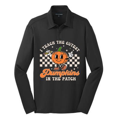 I Teach The Cutest Pumpkins In The Patch Teacher Halloween Silk Touch Performance Long Sleeve Polo