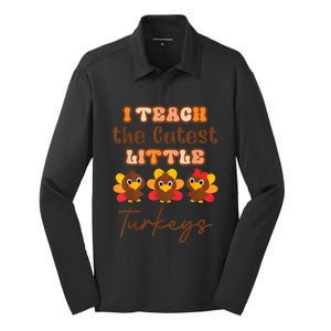 I Teach The Cutest Little Turkeys Teacher Thanksgiving Silk Touch Performance Long Sleeve Polo