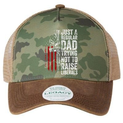 Just A Regular Dad Trying Not To Raise Liberals Legacy Tie Dye Trucker Hat