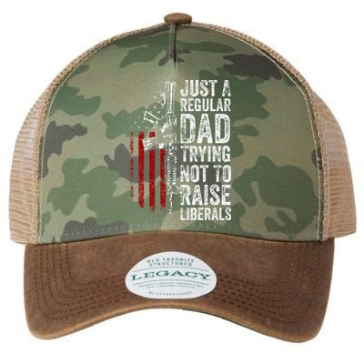 Just A Regular Dad Trying Not To Raise Liberals Legacy Tie Dye Trucker Hat