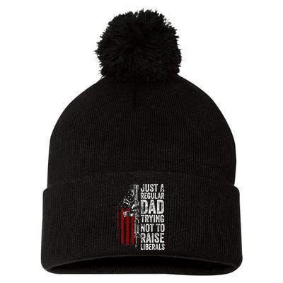 Just A Regular Dad Trying Not To Raise Liberals Pom Pom 12in Knit Beanie