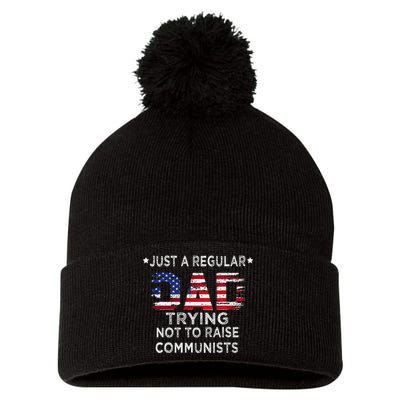 Just A Regular Dad Trying Not To Raise Communists Pom Pom 12in Knit Beanie